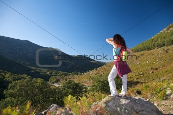 rucksack woman over valley