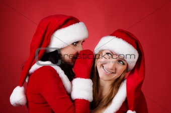 wo happy young Santa girl talking 