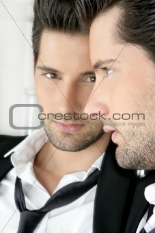 Handsome narcissistic young man looking in a mirror 