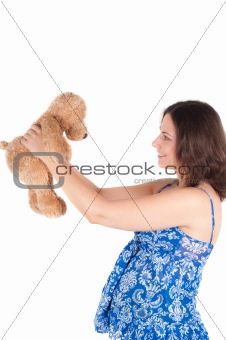 Portrait of pretty pregnant woman with toy