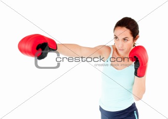 Athletic hispanic woman with boxing gloves working out