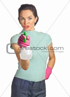 Portrait of beautiful young housewife with spray bottle