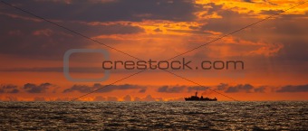 Navy ship on sunset