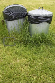 waste bins in grass