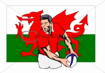Rugby player passing the ball with Welsh flag