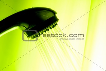 backlit showerhead with green background
