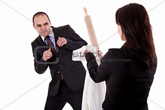 woman arguing with her husband, pointing to the rolling pin and a shirt with lipstick mark