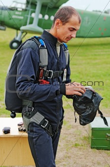 Portrait of the parachutist in overalls 