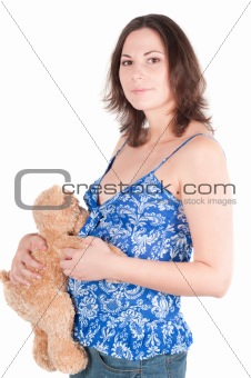 Portrait of pretty pregnant woman with toy
