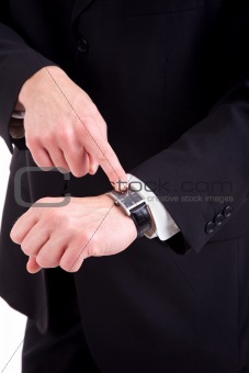 businessman pointing to the watch