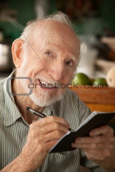 Senior man with checkbook