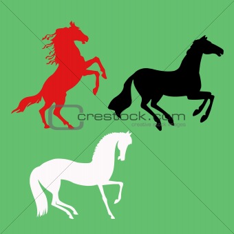 vector silhouette of the horses on green background