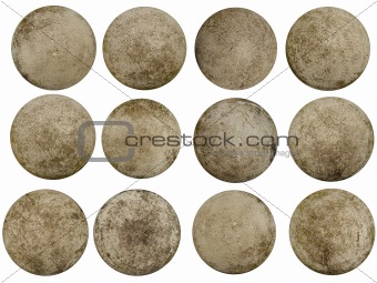 12 worn concrete spheres resembling planets