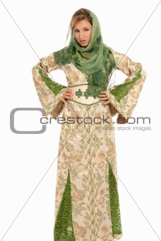 Young arab woman with veil standing isolated on white background