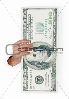 Hand holds huge dollar isolated on white