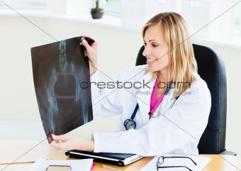 Smiling female looking at X-ray