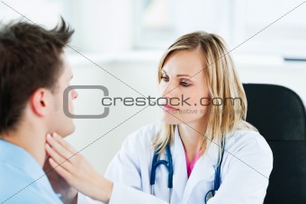 Doctor examining her male patient 