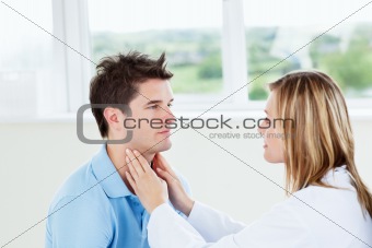 Female doctor examinating her male patient 
