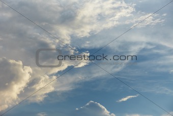 Blue sky is covered by light clouds
