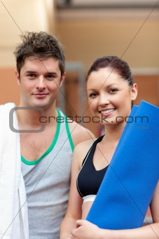 portrait of a happy couple after fitness exercices smiling to th