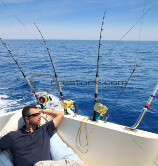 Sailor man fishing resting in boat summer vacation