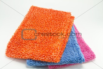 Pile of various multicolor microfibre cloths