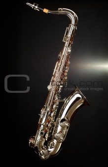 gold saxophote on black background