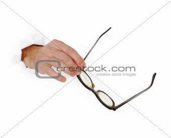 Hand holds glasse on white background