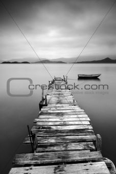 black and white peer with boat