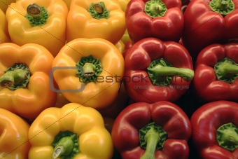 Red and yellow peppers at market