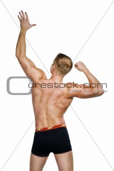 Shirtless bodybuilder posing