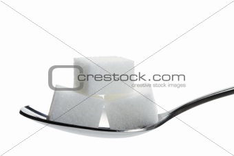 three lump sugar on a spoon
