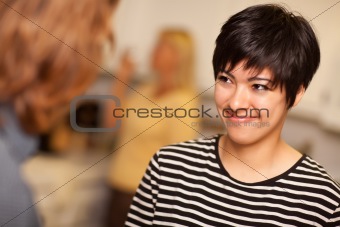 Smiling Young Woman Socializing in a Party Setting.