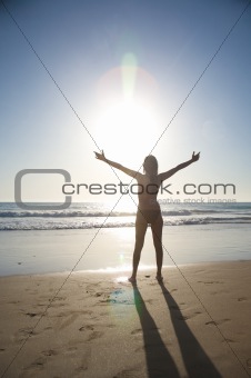 beach woman greeting sun