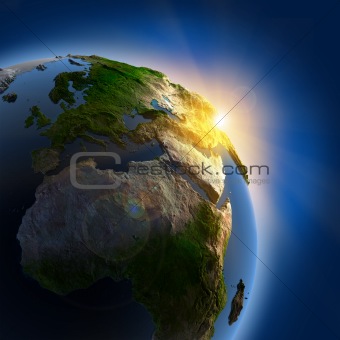 Sunrise over the Earth in outer space