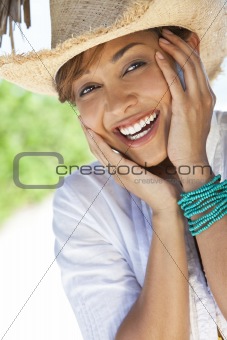 Beautiful Mixed Race Woman Laughing In Straw Cowboy Hat