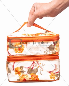 cosmetic bag in hand