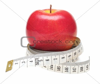 tape measure wrapped around red apple