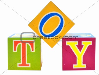 word toy spelled out in toy blocks