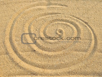 photo of spiral pattern in the sand 