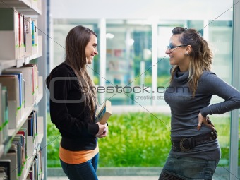 students talking in library