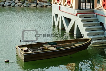 Rowboat beside marina stairs