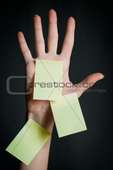 female hand with blank note