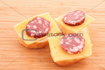 Sandwiches with sausage, cheese and bread