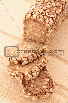 Bread on wooden plate isolated on white