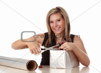 cute woman wrapping a xmas gift
