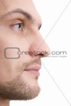 Man's face with blue eyes in a profile