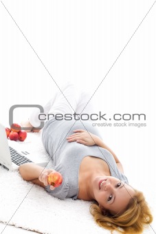 Pregnant woman relaxing on the floor