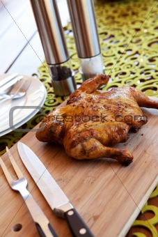 Whole chicken with cutlery and spices