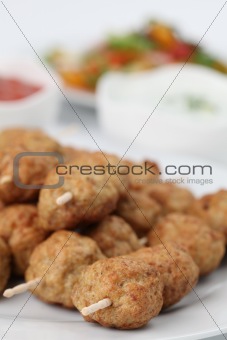 Meatballs with dips and salad